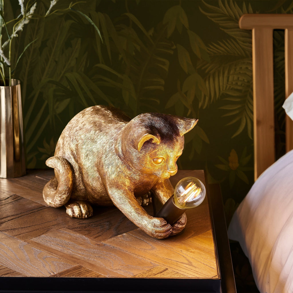 Lámpara de mesa WhiskerGlow con forma de gato, de resina, en dorado antiguo y negro mate