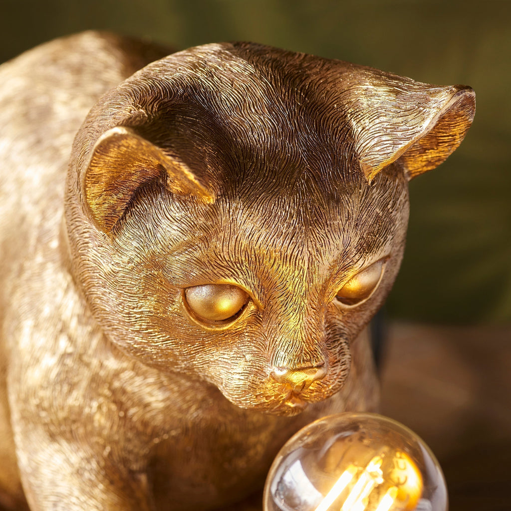 Lámpara de mesa WhiskerGlow con forma de gato, de resina, en dorado antiguo y negro mate