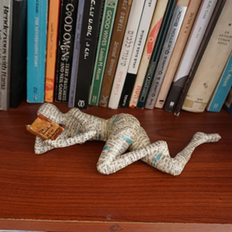 Resin Reading Statue Featuring Newspaper Print Design | ribuella