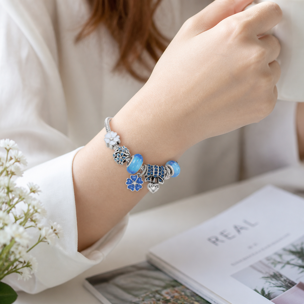 Justerbart armbånd i rustfrit stål med ferskenblomstvedhæng | ribuella