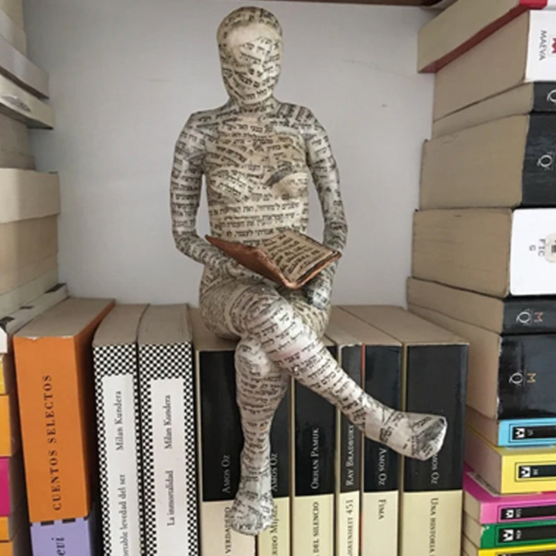 Resin Reading Statue Featuring Newspaper Print Design | ribuella