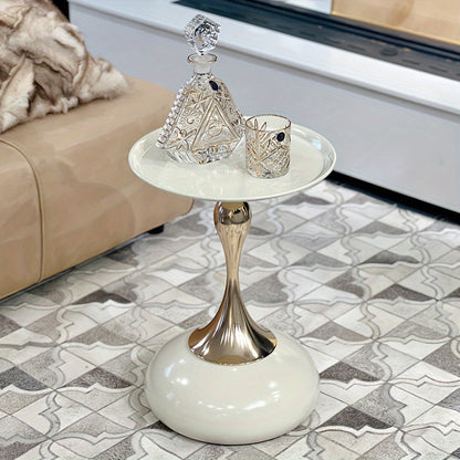 Stylish side table featuring a gold tulip-shaped base | ribuella