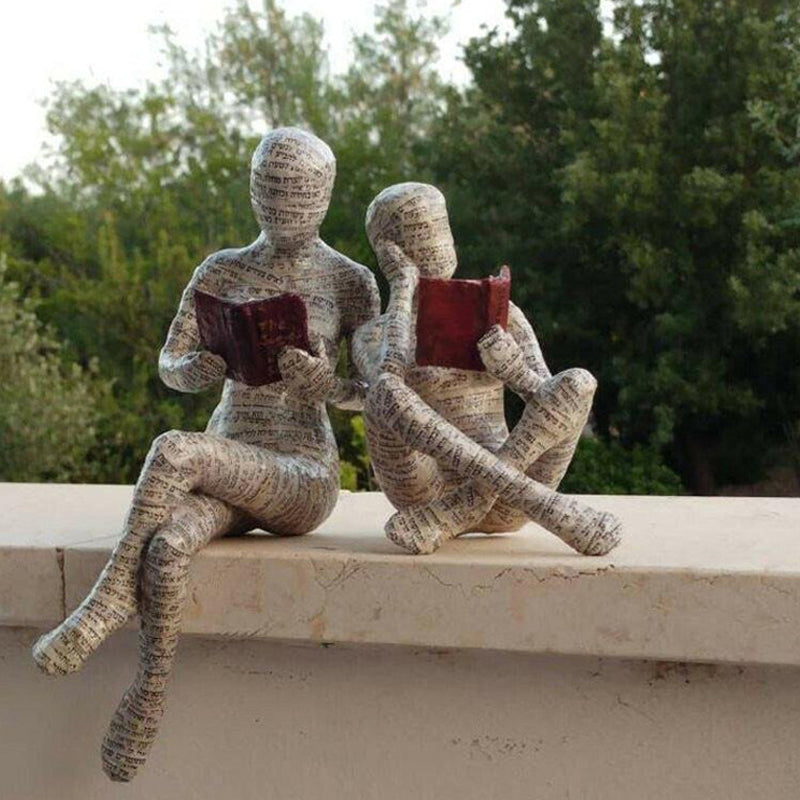 Resin Reading Statue Featuring Newspaper Print Design | ribuella
