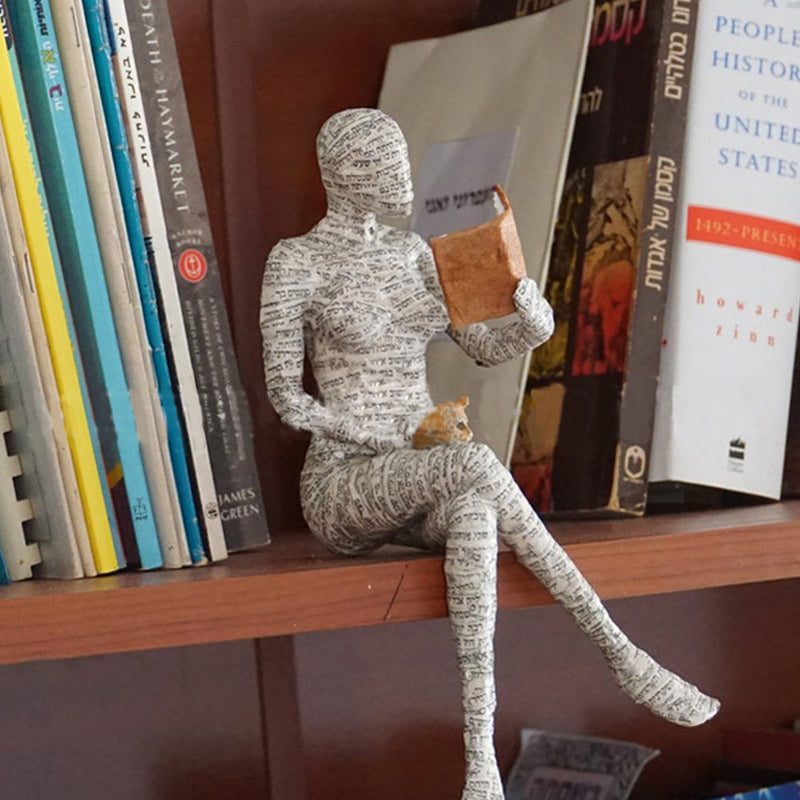 Resin Reading Statue Featuring Newspaper Print Design | ribuella