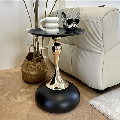 Stylish side table featuring a gold tulip-shaped base | ribuella
