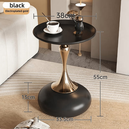 Stylish side table featuring a gold tulip-shaped base | ribuella