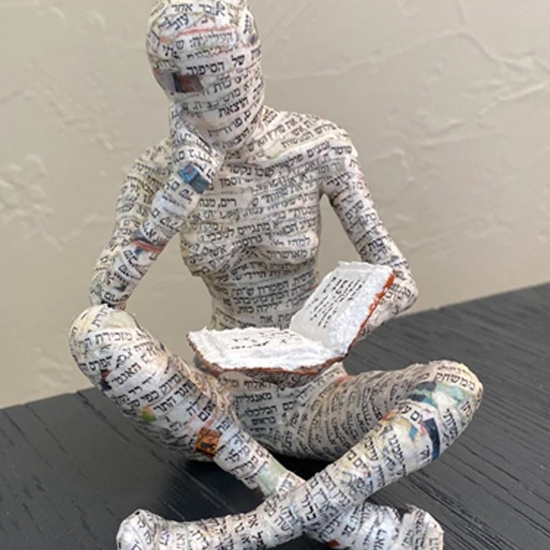 Resin Reading Statue Featuring Newspaper Print Design | ribuella