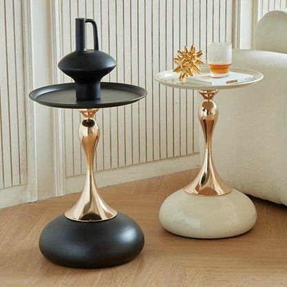 Stylish side table featuring a gold tulip-shaped base | ribuella