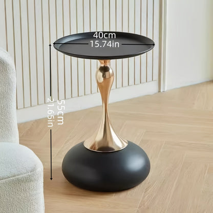Stylish side table featuring a gold tulip-shaped base | ribuella