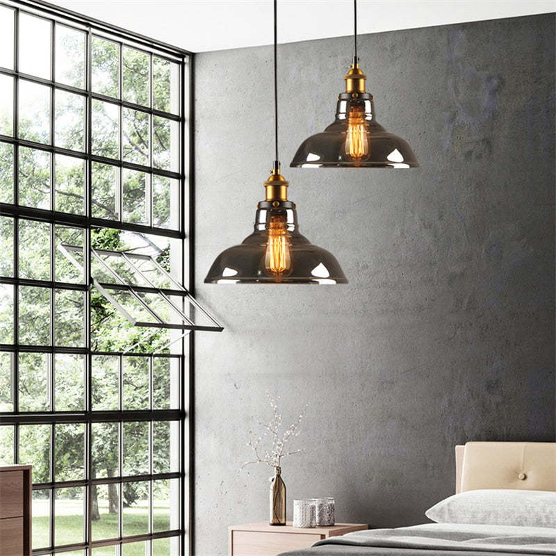 Lampada a sospensione industriale June in vetro trasparente, ambrato o grigio fumo