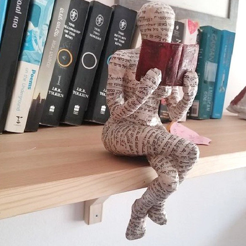 Resin Reading Statue Featuring Newspaper Print Design | ribuella
