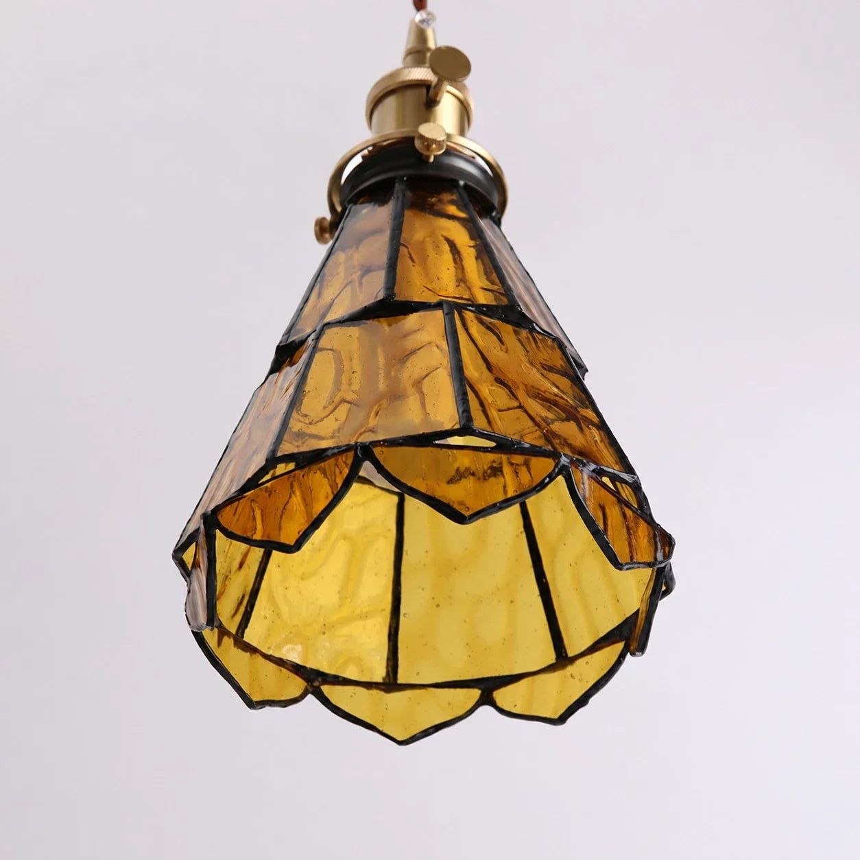 French Country Amber Rippled Glass Wall Fixture Finished In Warm Brass Hardware
