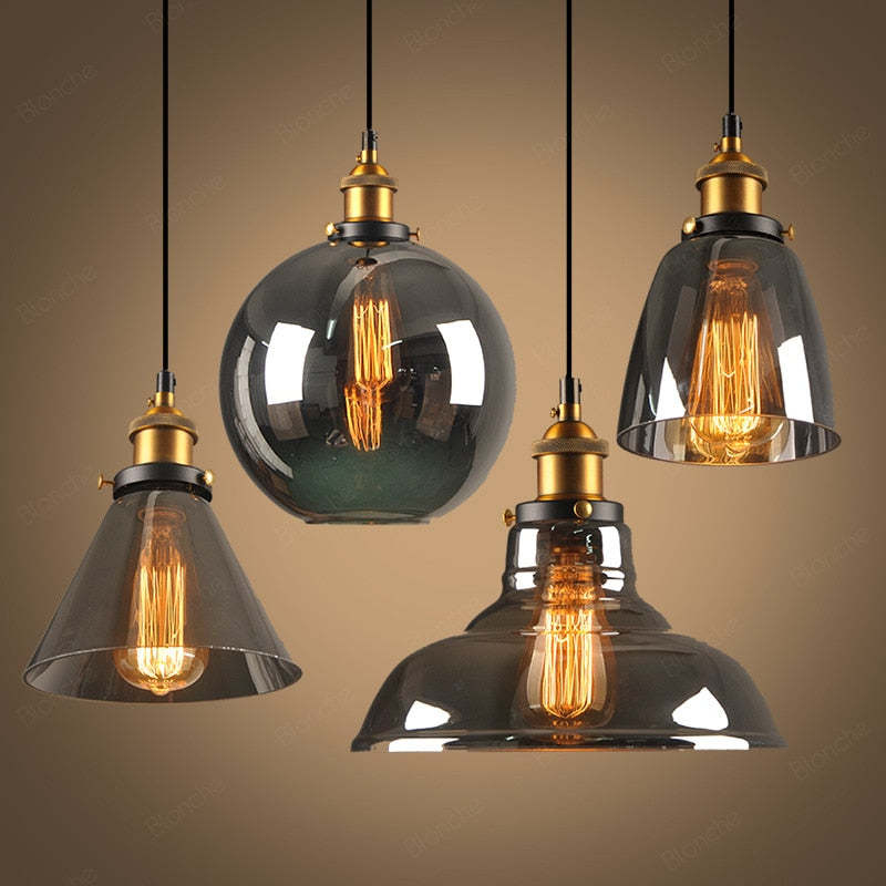 Lampada a sospensione industriale June in vetro trasparente, ambrato o grigio fumo