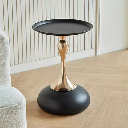 Stylish side table featuring a gold tulip-shaped base | ribuella