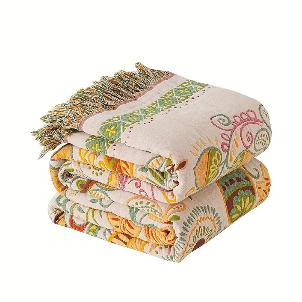 Manta reversible de estilo bohemio, vibrante estampado de hojas otoñales y bordes con borlas