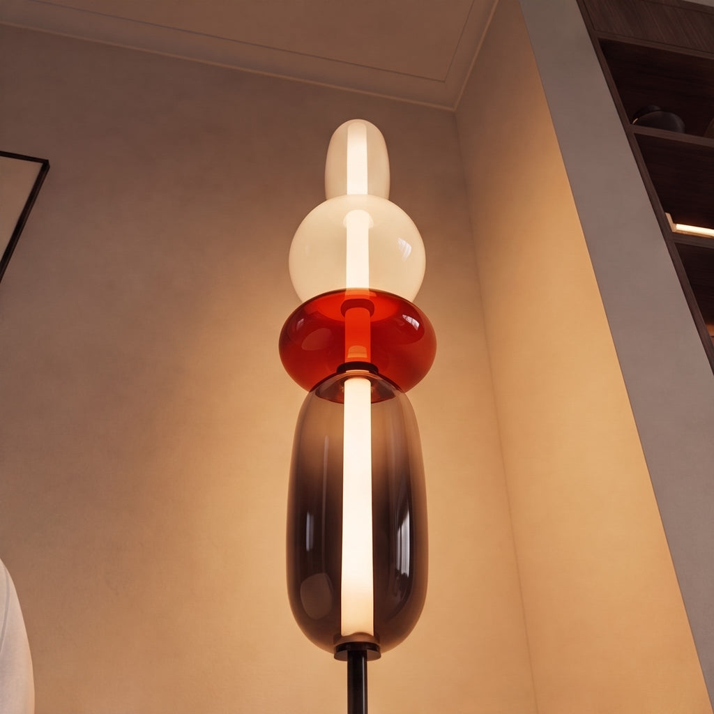 Moderní stojací lampa s nastavitelnou výškou, skleněným LED osvětlením a designem vrstvených oblázků | ribuella