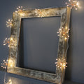 Ciepłobiałe girlandy świetlne LED w kształcie rozbłysków gwiazd, 10 skupisk, po 150 diod LED, odstępy 35 cm