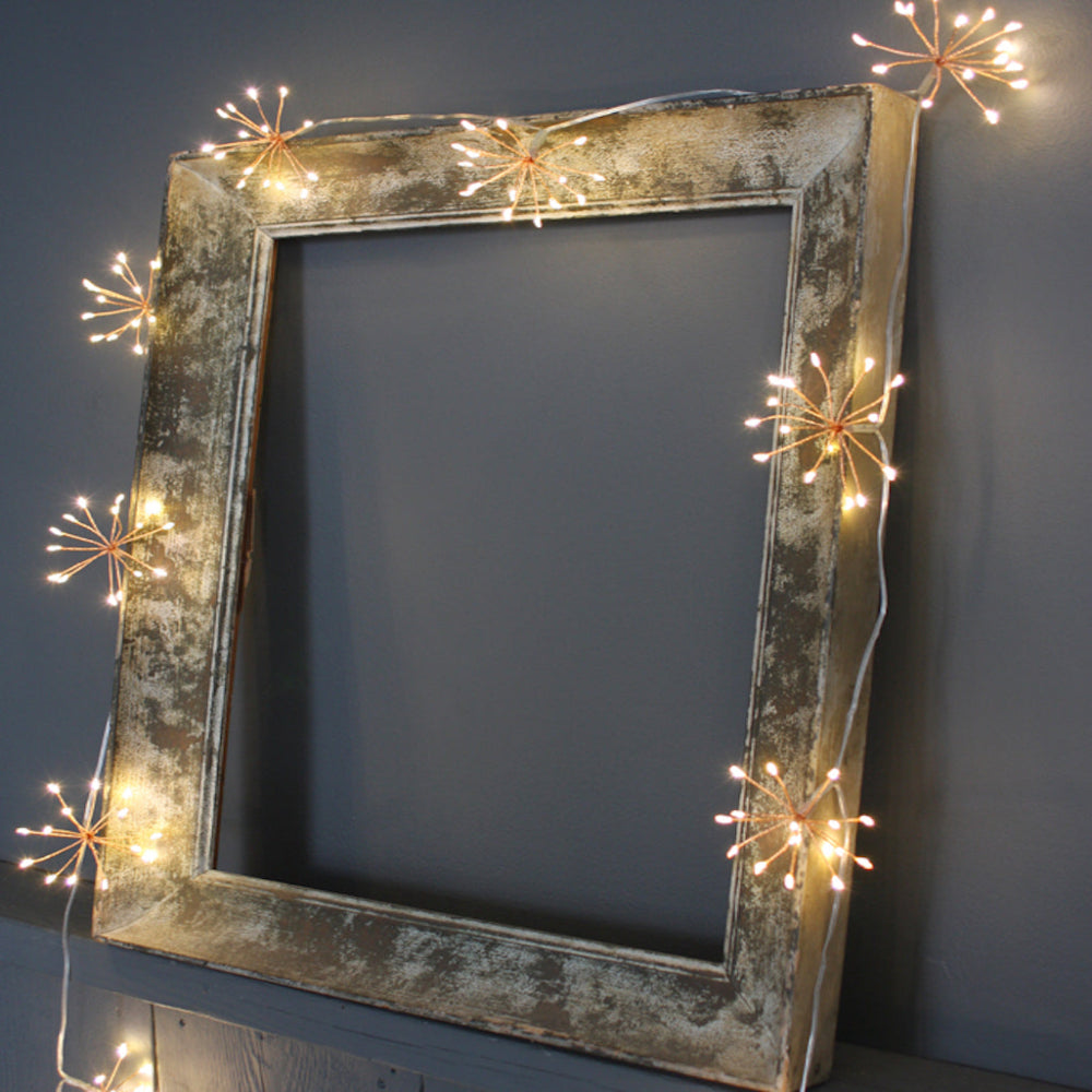 Ciepłobiałe girlandy świetlne LED w kształcie rozbłysków gwiazd, 10 skupisk, po 150 diod LED, odstępy 35 cm