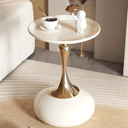 Stylish side table featuring a gold tulip-shaped base | ribuella