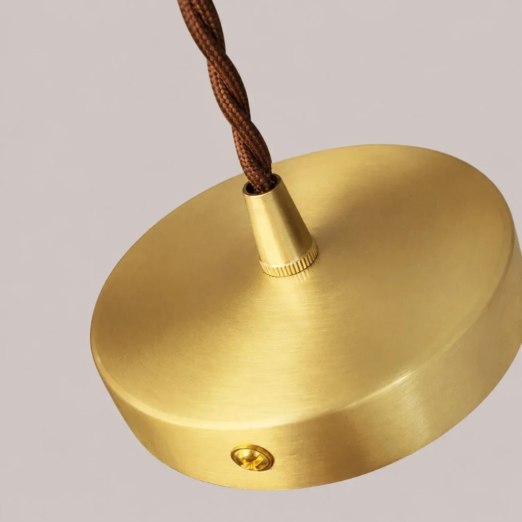 French Country Amber Rippled Glass Wall Fixture Finished In Warm Brass Hardware