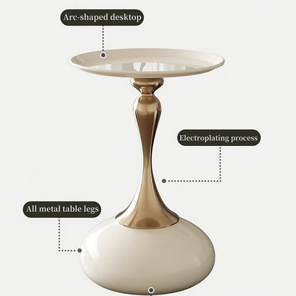 Stylish side table featuring a gold tulip-shaped base | ribuella