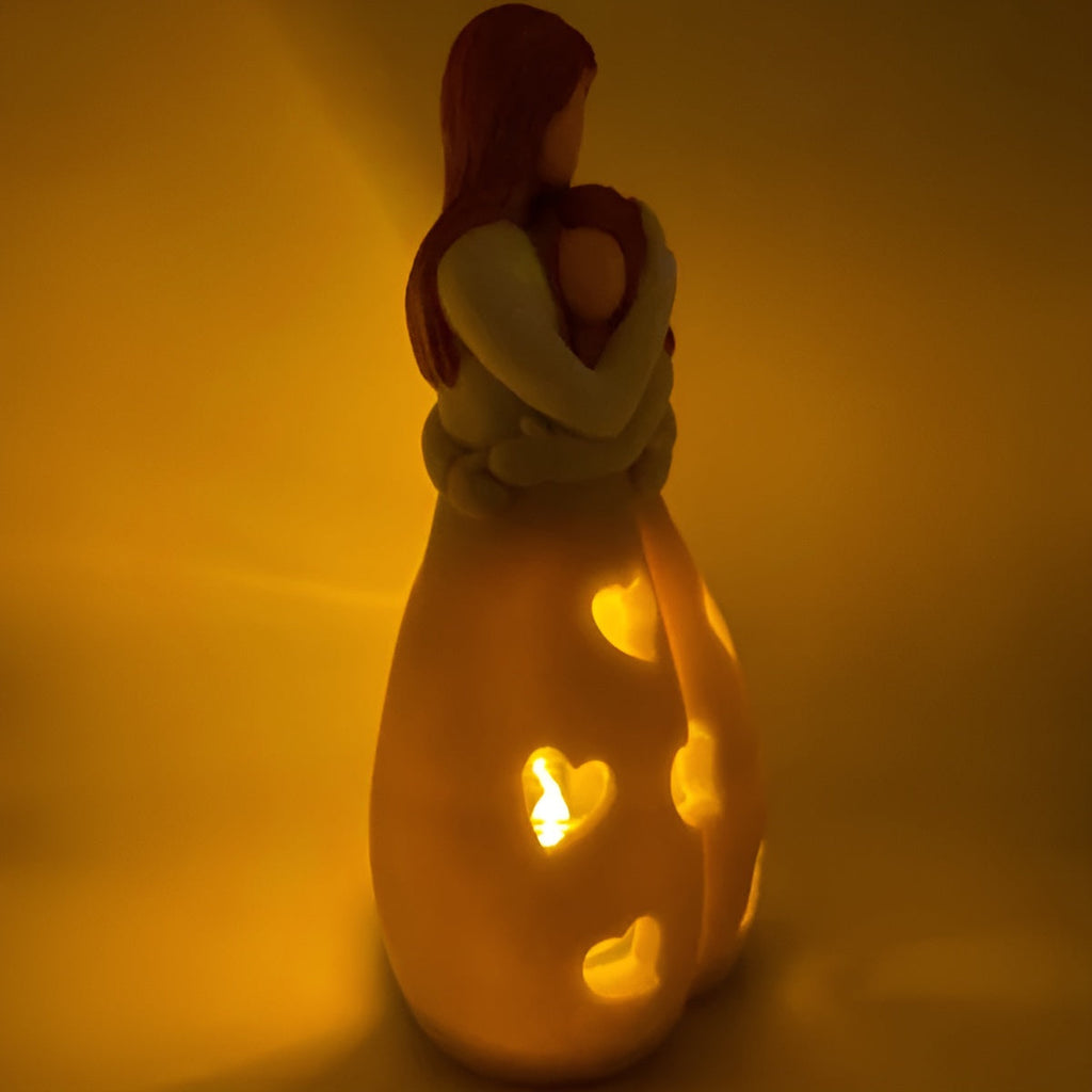 Luz decorativa Embrace Glow - Parpadeo cálido y efecto de sombras suaves