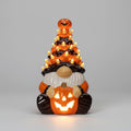 Halloween-Keramik-Wichtel-Lichtfigur mit geschnitztem Kürbis als Laterne