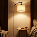 Moderne schwarze Bogen-Stehlampe mit höhenverstellbarem Stoffschirm für das Wohnzimmer | ribuella