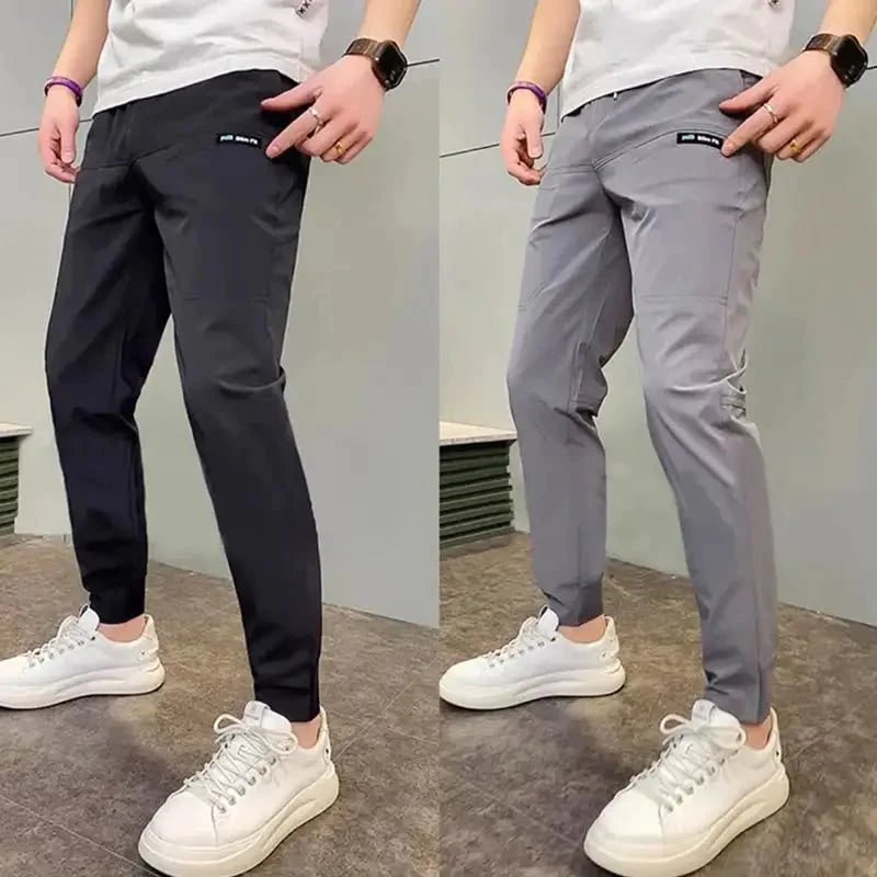 Pánské zúžené jogger kalhoty - úzký střih, lehký strečový materiál, boční kapsy