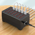 USB nabíjecí hub se 30 porty, černý obdélníkový design, jednotlivé očíslované porty